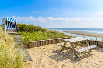 Papier Peint photo Lavable Mer du Nord, Pays-Bas Beach chair and table on coast of Sylt island near List village, Germany