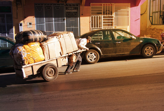 MOROCCO, ESSAOUIRA - January 04, 2013. Port of Essaouira. People going on the embankment of the Essaouira