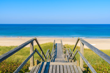Wooden steps from sand dune to beautiful Westeland beach, Sylt island, Germany