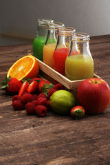 several bottles with fruit and berry juices smoothies 