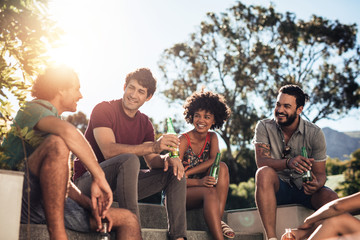 Young people partying outdoors on summer day
