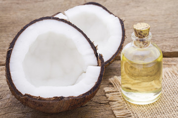Fragments of coconut on wooden background