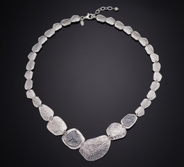 Golden necklace with isolated on black