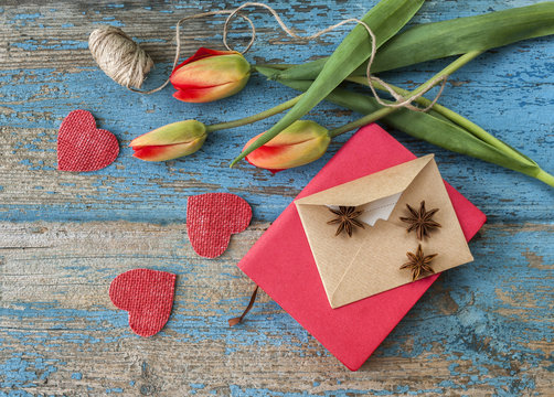 Notebook and envelope on a wooden table