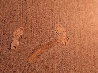 Detail with a sport shoe footprint on a tennis clay court