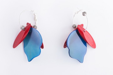 Colorful bright earrings isolated on white background