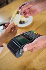 Senior woman making payment through credit card