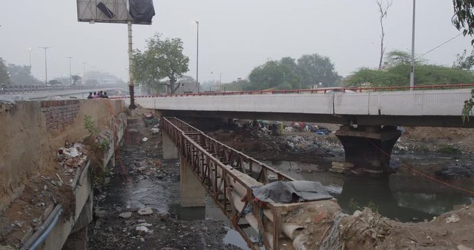 A river runs near Barapullah Elvated Road.