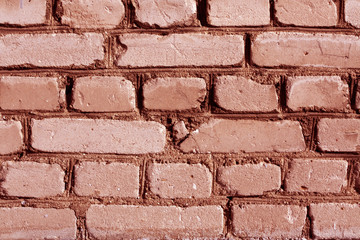 Obraz premium Red toned weathered brick wall texture.