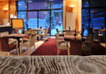 Empty wooden table space platform and blurred resturant or coffee shop background for product display montage