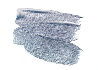 Abstract brush strokes with silver paint on white paper