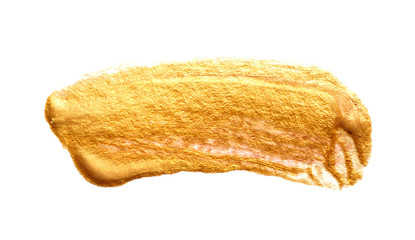 Abstract brush strokes with gold paint on paper