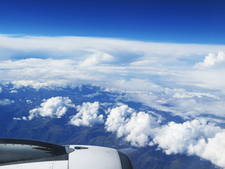 Naklejka na ściany i meble Engine of the plane on blue sky background