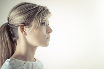 Profile of a beautiful serious blond woman