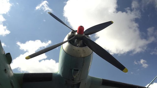 Engine and propeller of the old retro transport plane. Fragment of the aircraft.
