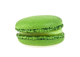 Green tasty macaroon on a white background