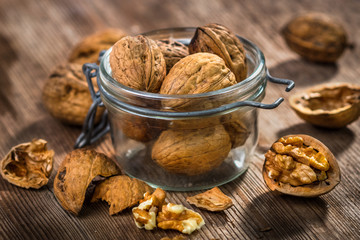 Wallnuts on vintage wooden table