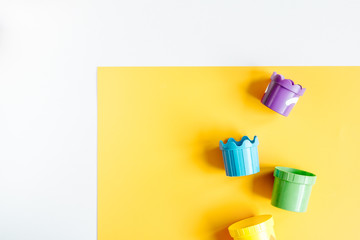 children flat lay with toys colorful background top view space for text