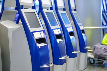 Self check in terminals in hall of airport