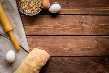 bakery concept with homemade bread on rustic background top view moke-up