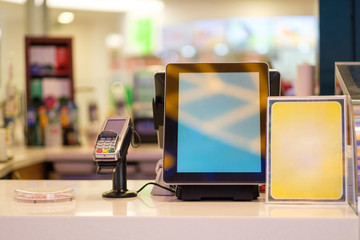 Cash desk with order screen and card payment terminal in small cafe
