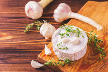French homemade Camembert cheese with thyme and garlic