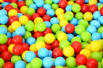 Fototapeta na wymiar Colorful plastic balls in children’s playground 