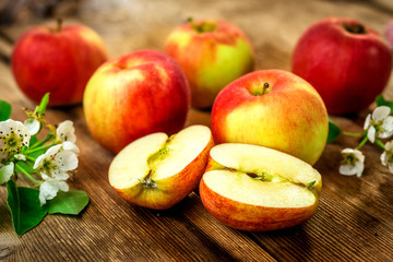Raw organic apples on wooden background