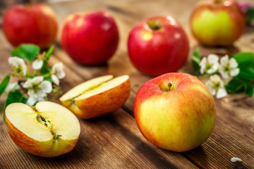 Naklejka na ściany i meble Raw organic apples on wooden background