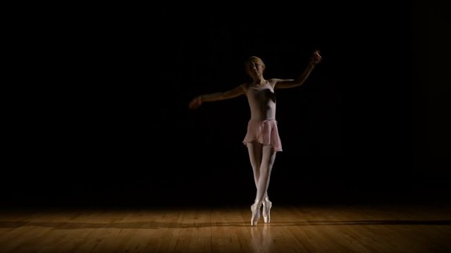 Sensual ballerina dancer practicing in the studio