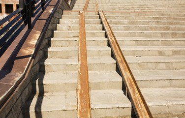 Concrete staircase with a ramp