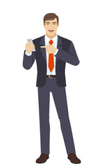 Businessman pointing at a mobile phone