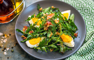 Dandelion salad with eggs and bacon