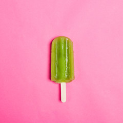 Tasty and refreshing popsicles on pink background