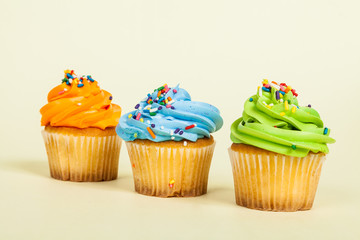 Three tasty  decorated muffins