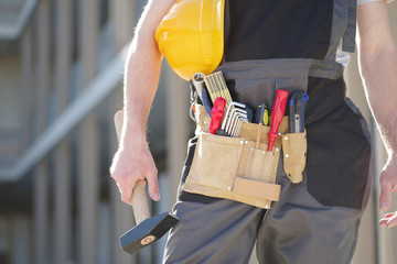 Werkzeuggürtel, Handwerker auf der Baustelle