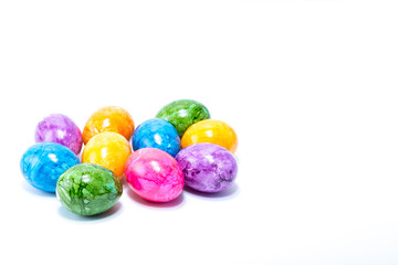 Ten easter eggs hand painted in home - abstract different colors, isolated in white background