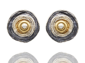 Golden earrings  isolated on white background