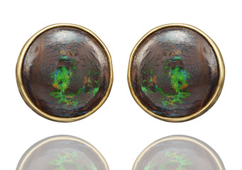 Golden earrings with gemstone isolated on white background