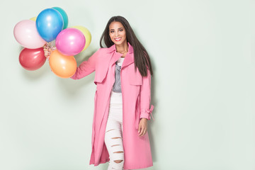 Fototapeta premium Happy young woman with balloons.