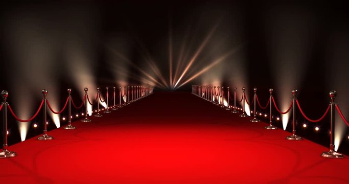 Red carpet with spotlights against black background