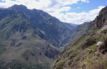 Fototapeta premium Hiking trail through the Andean mountains surrounding the stunning and massive Colca Canyon in Southern Peru 