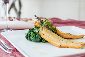 Roasted fillet of sea bass with spinach