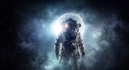 Fototapeta na wymiar Astronaut in outer space. Mixed media . Mixed media