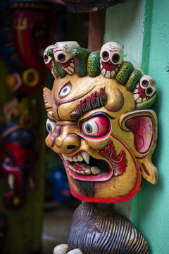 Colorful wooden masks and handicrafts on sale at shop in the Thamel District of Kathmandu, Nepal.