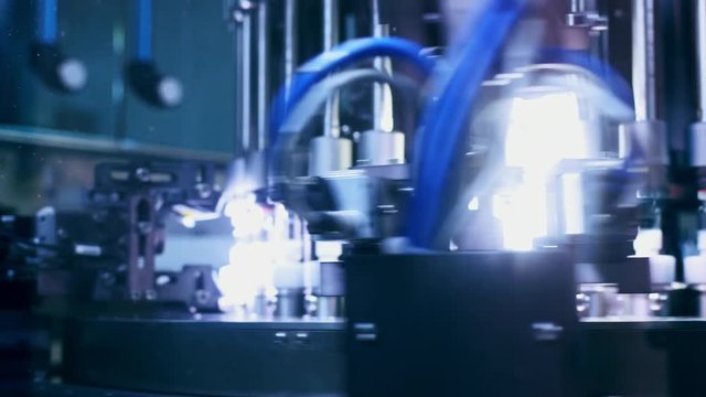 Medical ampoules quality control. Pharmaceutical vials quality control machine. Pharmaceutical manufacturing line. Pharmaceutical industry equipment. Pharmaceutical machine at medical factory