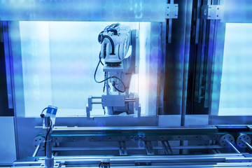 robotic arm machine tool at industrial manufacture plant,Smart factory industry 4.0 concept.