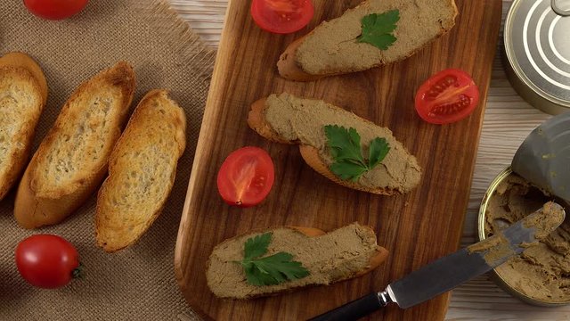 Fresh pate with bread on wooden table
