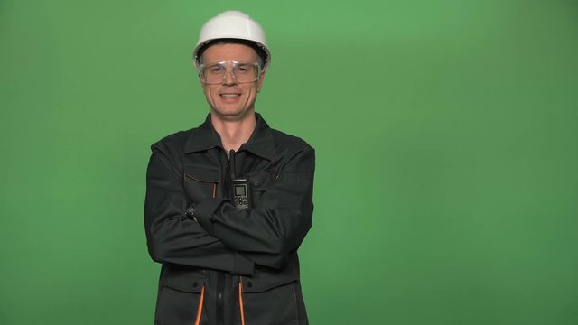 The adult taskmaster holding arms crossed and isolated on green screen