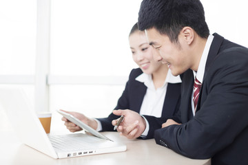 young asian businessman and businesswoman in modern office